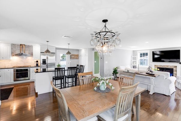 Chandelier, Dining room, Fireplace, Interior, Kitchen, Living room, Pendant Lights, Recessed Lighting, Stainless Steel Appliances, Wood Texture Flooring