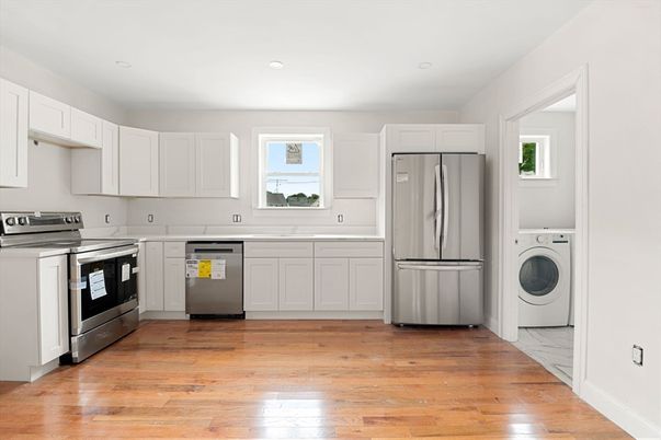 Interior, Kitchen, Recessed Lighting, Washer, Wood Texture Flooring