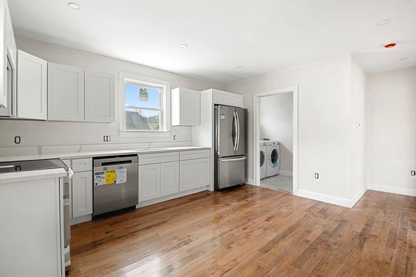 Interior, Kitchen, Recessed Lighting, Washer, Wood Texture Flooring