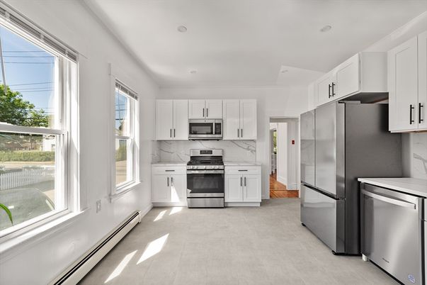 Interior, Kitchen, Marble Walls, Recessed Lighting, Stainless Steel Appliances