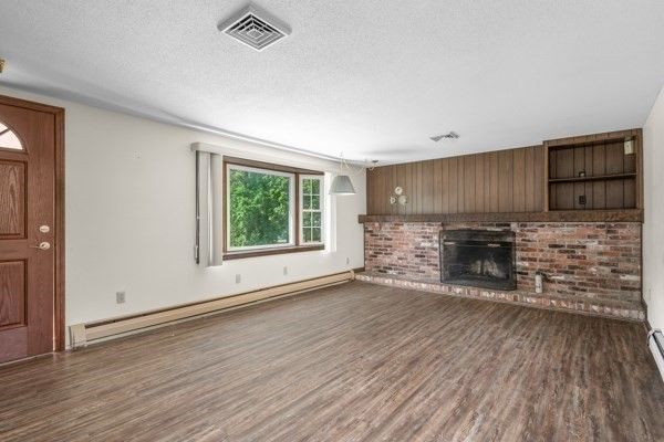 Empty room, Fireplace, Interior, Pendant Lights, Stone Walls, Wood Texture Flooring