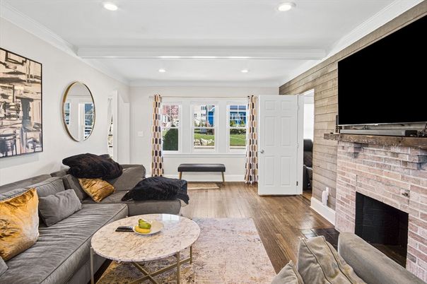 Fireplace, Interior, Living room, Recessed Lighting, Stone Walls, Wood Texture Flooring