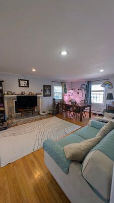 Dining room, Fireplace, Interior, Living room, Recessed Lighting, Wood Texture Flooring