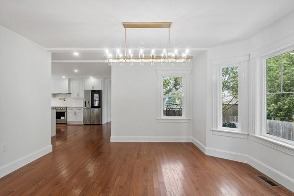 Empty room, Interior, Kitchen, Pendant Lights, Recessed Lighting, Stainless Steel Appliances, Wood Texture Flooring
