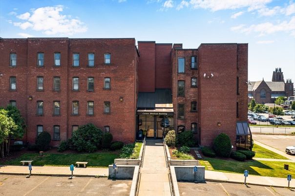 Exterior, Facade, Brick Facade, Condo Building