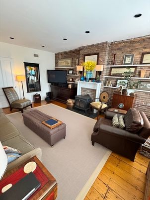 Fireplace, Interior, Living room, Recessed Lighting, Stone Walls, Wood Texture Flooring, Wooden Walls