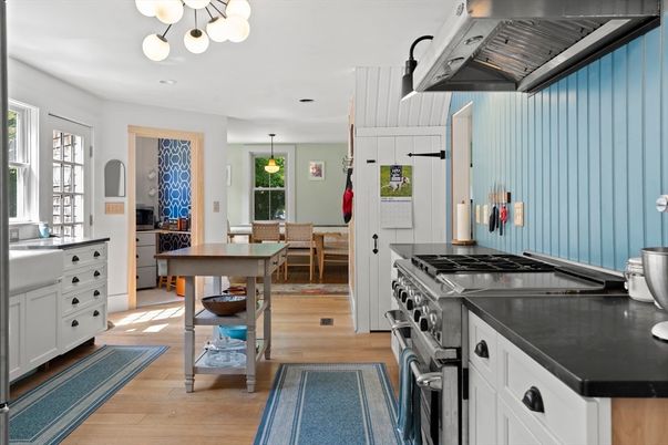 Chandelier, Dining room, Interior, Kitchen, Pendant Lights, Recessed Lighting, Stainless Steel Appliances, Wood Texture Flooring