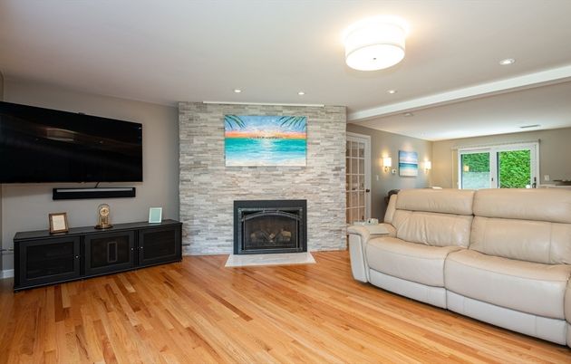 Fireplace, Interior, Living room, Recessed Lighting, Stone Walls, Wood Texture Flooring