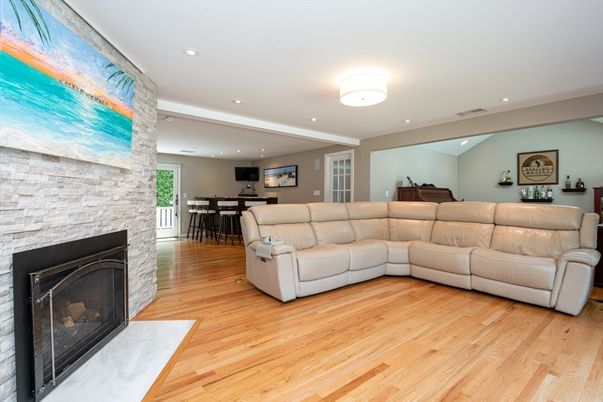 Fireplace, Interior, Living room, Recessed Lighting, Stone Walls, Wood Texture Flooring