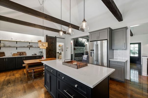 Chandelier, Dining room, Fireplace, Interior, Kitchen, Pendant Lights, Stainless Steel Appliances, Wooden Beams, Wood Texture Flooring
