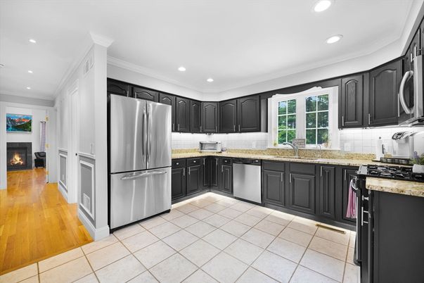 Fireplace, Interior, Kitchen, Recessed Lighting, Stainless Steel Appliances, Wood Texture Flooring