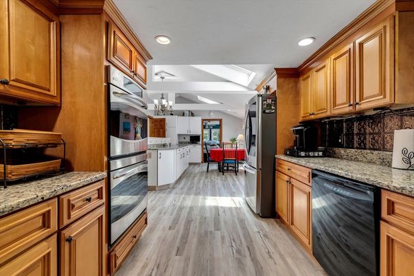 Chandelier, Dining room, Interior, Kitchen, Recessed Lighting, Stainless Steel Appliances, Wood Texture Flooring