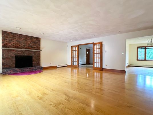 Empty room, Fireplace, Interior, Recessed Lighting, Stone Walls, Wood Texture Flooring