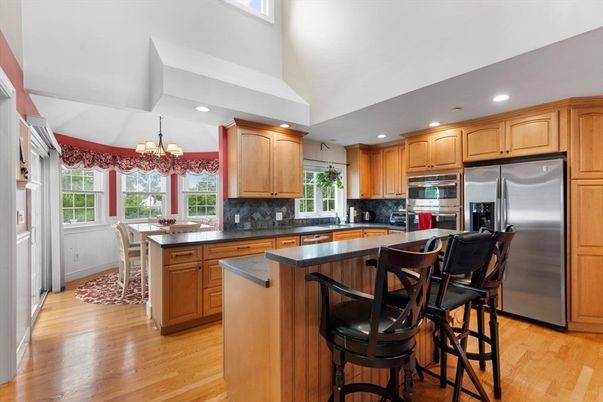 Chandelier, Dining room, Interior, Kitchen, Recessed Lighting, Stainless Steel Appliances, Wood Texture Flooring