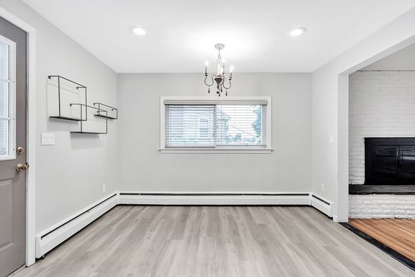 Chandelier, Empty room, Fireplace, Interior, Recessed Lighting, Wood Texture Flooring