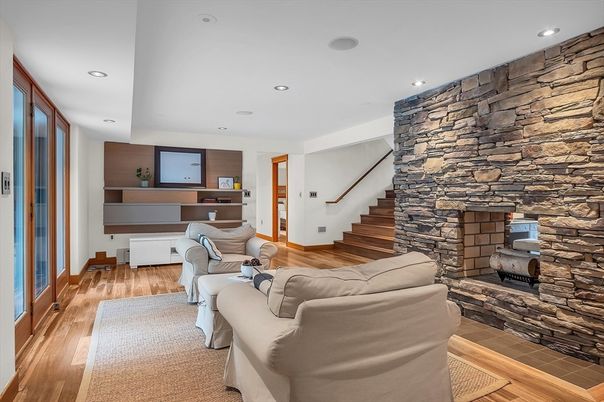 Fireplace, Interior, Living room, Recessed Lighting, Stone Walls, Wood Texture Flooring