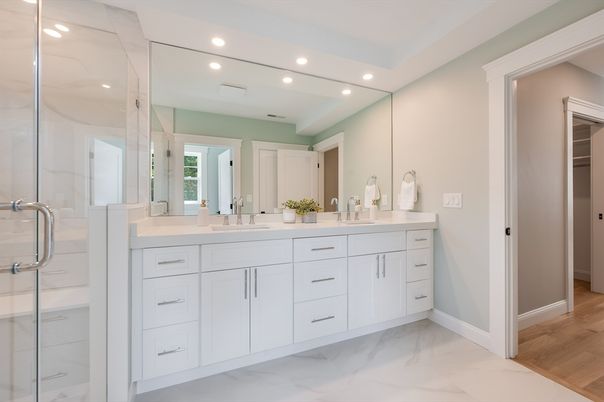 Bathroom, Dual Sink Vanities, Glass Shower, Interior, Marble, Recessed Lighting, Wood Texture Flooring