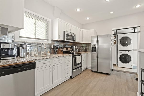 Interior, Kitchen, Recessed Lighting, Stainless Steel Appliances, Washer, Wood Texture Flooring