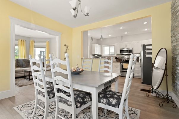 Dining room, Interior, Kitchen, Living room, Recessed Lighting, Stainless Steel Appliances, Wood Texture Flooring