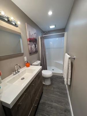 Bathroom, Dual Sink Vanities, Interior, Recessed Lighting, Wood Texture Flooring