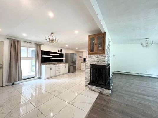 Chandelier, Fireplace, Interior, Marble, Recessed Lighting, Wood Texture Flooring