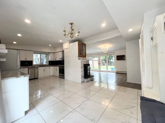 Chandelier, Fireplace, Interior, Kitchen, Marble, Recessed Lighting, Stainless Steel Appliances