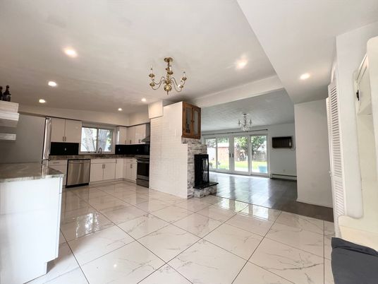 Chandelier, Fireplace, Interior, Kitchen, Marble, Recessed Lighting, Stainless Steel Appliances