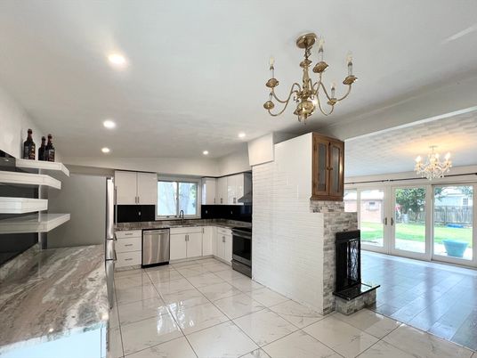 Chandelier, Fireplace, Interior, Kitchen, Marble, Recessed Lighting, Stainless Steel Appliances