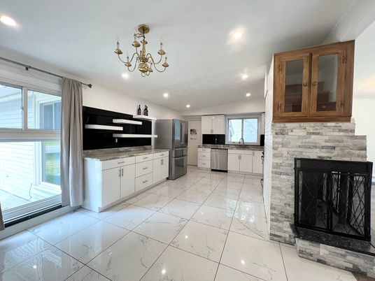 Chandelier, Fireplace, Interior, Kitchen, Marble, Recessed Lighting, Stainless Steel Appliances