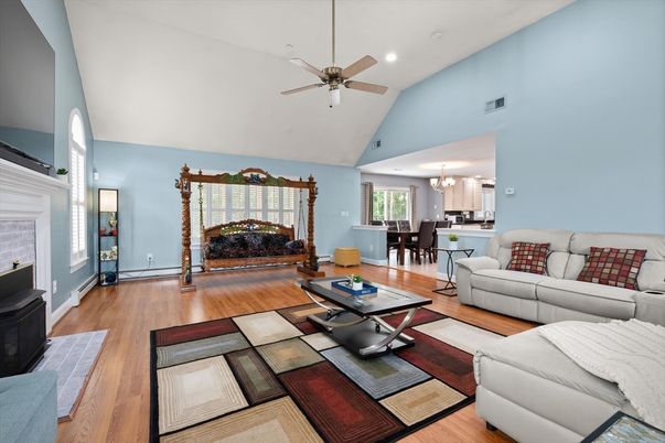 Chandelier, Dining room, Fireplace, Interior, Living room, Recessed Lighting, Wood Texture Flooring