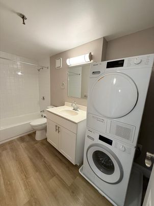 Bathroom, Interior, Utility Closets, Washer, Wood Texture Flooring