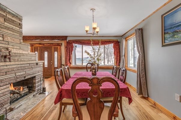 Chandelier, Dining room, Fireplace, Interior, Stone Walls, Wood Texture Flooring