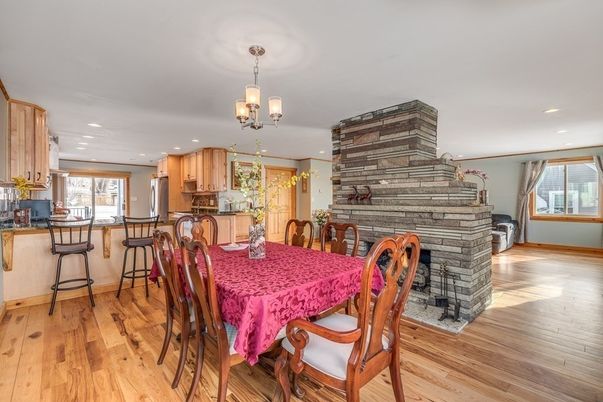 Chandelier, Dining room, Fireplace, Interior, Kitchen, Recessed Lighting, Wood Texture Flooring