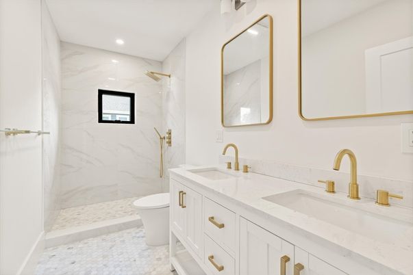 Bathroom, Dual Sink Vanities, Glass Shower, Interior, Marble, Marble Walls, Recessed Lighting