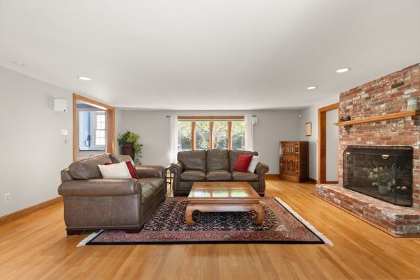 Fireplace, Interior, Living room, Recessed Lighting, Stone Walls, Wood Texture Flooring