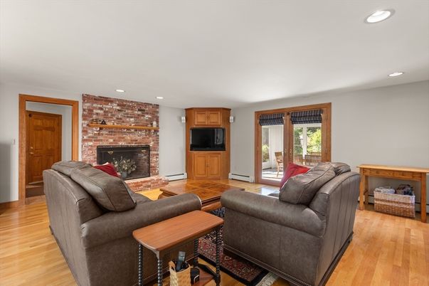 Fireplace, Interior, Living room, Recessed Lighting, Stone Walls, Wood Texture Flooring