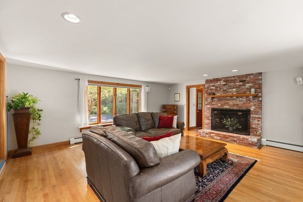 Fireplace, Interior, Living room, Recessed Lighting, Stone Walls, Wood Texture Flooring