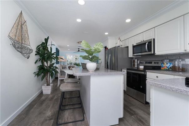 Dining room, Interior, Kitchen, Recessed Lighting, Stainless Steel Appliances, Wood Texture Flooring