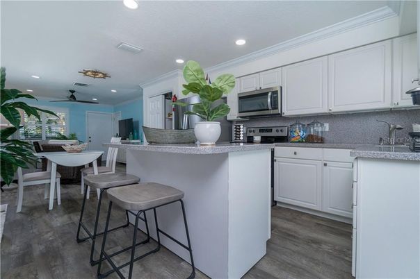 Dining room, Interior, Kitchen, Recessed Lighting, Stainless Steel Appliances, Wood Texture Flooring