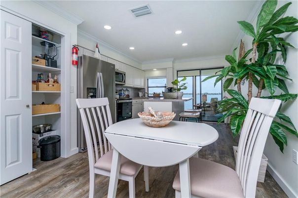 Dining room, Interior, Kitchen, Recessed Lighting, Stainless Steel Appliances, Wood Texture Flooring