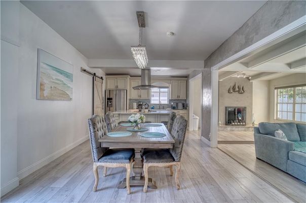 Chandelier, Dining room, Interior, Kitchen, Pendant Lights, Stainless Steel Appliances, Wood Texture Flooring