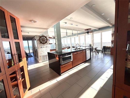 Dining room, Fireplace, Interior, Kitchen, Recessed Lighting, Stainless Steel Appliances, Stone Walls