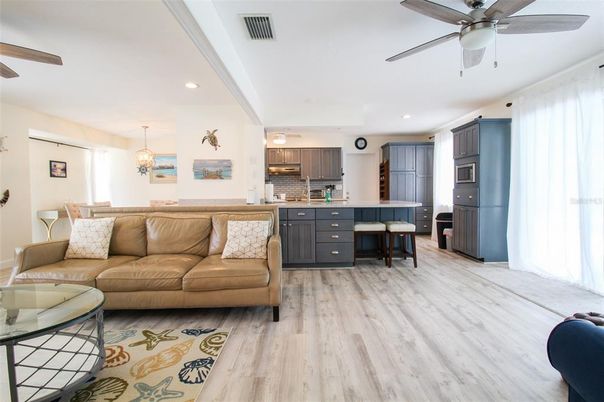 Interior, Kitchen, Wood Texture Flooring, Recessed Lighting, Living room, Dining room, Chandelier, Stainless Steel Appliances, Pendant Lights