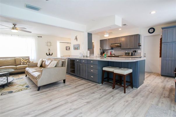 Interior, Kitchen, Wood Texture Flooring, Recessed Lighting, Living room, Stainless Steel Appliances, Pendant Lights