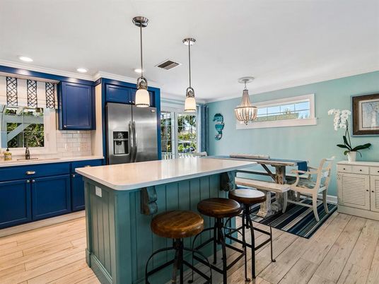 Dining room, Interior, Kitchen, Pendant Lights, Recessed Lighting, Stainless Steel Appliances, Wood Texture Flooring