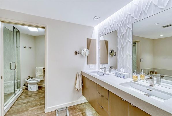 Bathroom, Dual Sink Vanities, Glass Shower, Interior, Recessed Lighting, Wood Texture Flooring
