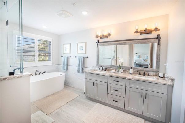 Bathroom, Dual Sink Vanities, Free Standing Baths, Interior, Recessed Lighting, Wood Texture Flooring