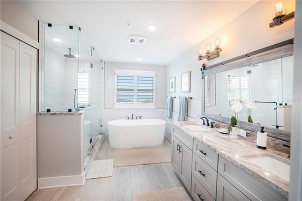 Bathroom, Dual Sink Vanities, Free Standing Baths, Glass Shower, Interior, Recessed Lighting, Wood Texture Flooring