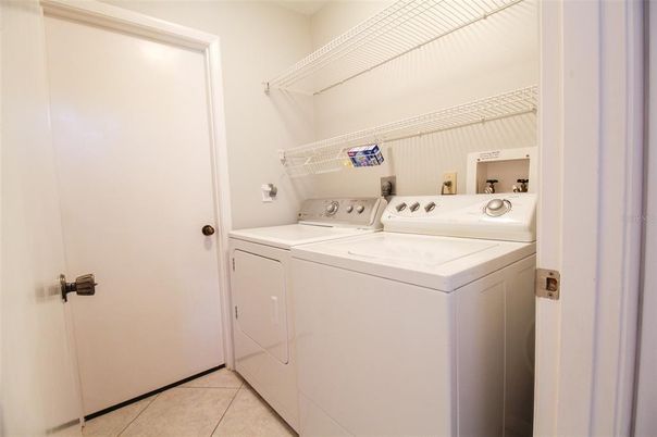 Interior, Washer, Tile Countertops, Ceramic Tile, Utility Closets