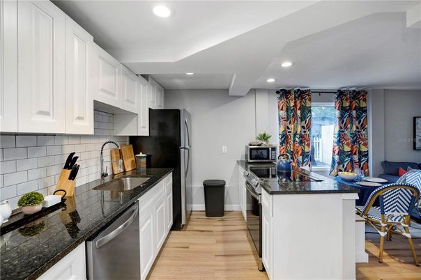 Interior, Kitchen, Recessed Lighting, Stainless Steel Appliances, Wood Texture Flooring